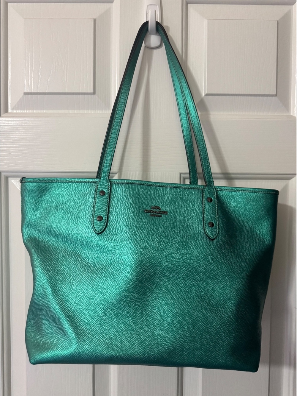 C32.Coach City Zip Tote crafted from metallic crossgrain leather.